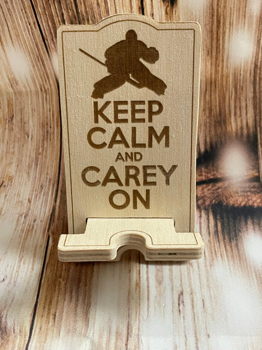 Keep claim and Carey on phone stand