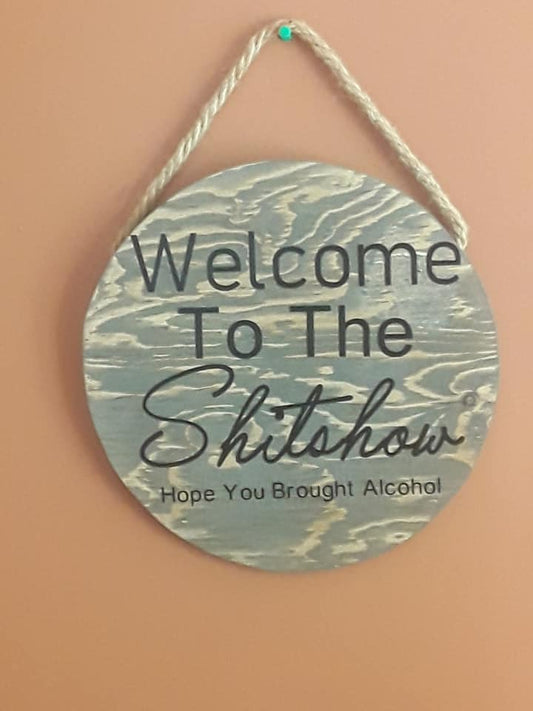 Welcome to shit show round sign